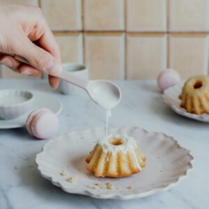 sweet cupcake on yellow tiled photo background